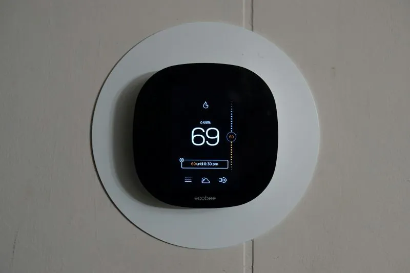 An indoor thermostat exhibiting a cool 69 degrees inside a Phoenix West Valley home.