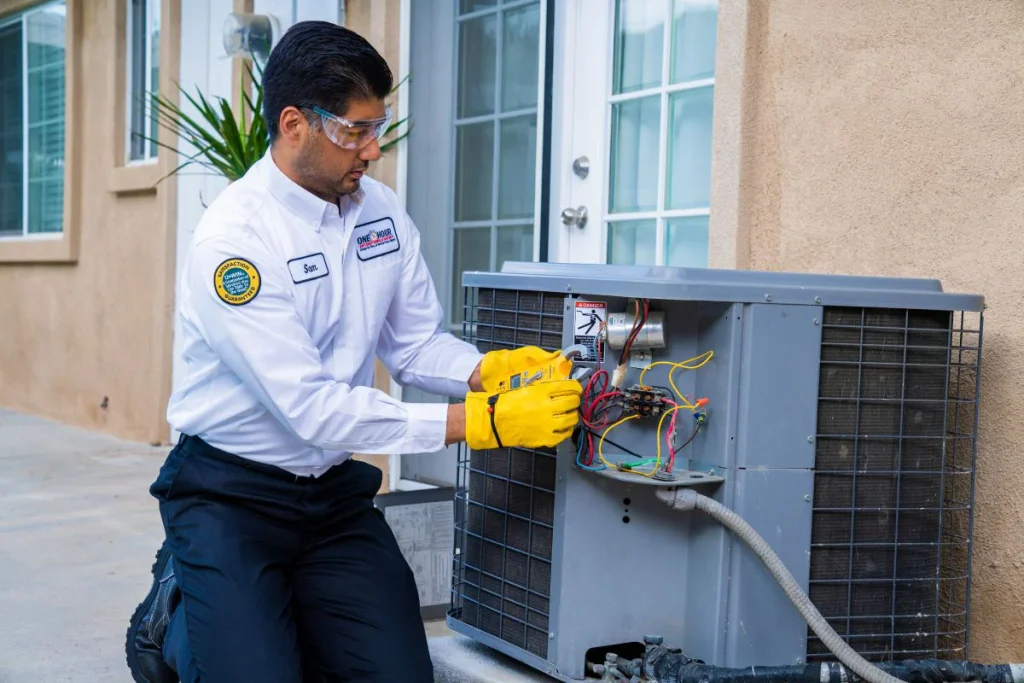 One Hour Heating and Air Conditioning tech diagnosing a residential HVAC unit in Surprise, AZ for AC Repairs.