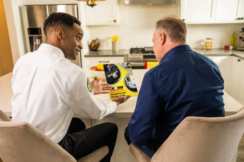 One Hour Heating and Air Conditioning-Phoenix West Valley techs sitting with a Sun City, AZ homeowner on HVAC financing after needing new HVAC installation.