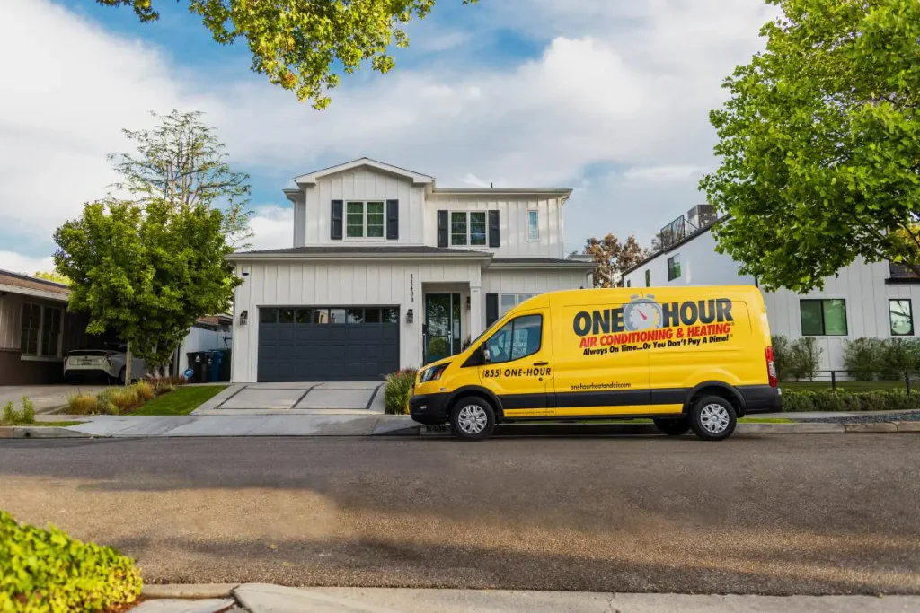 One Hour Heating and Air Conditioning wrapped van, sitting outside of a Phoenix West Valley home.